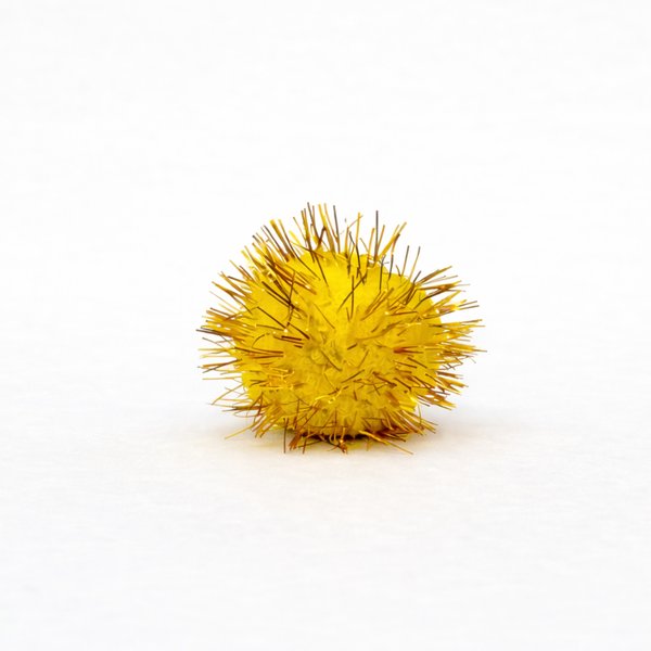 Close-up of victim - yellow spiky pom-pom ball