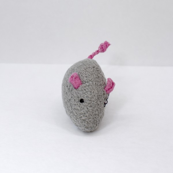 The victim — gray crocheted mouse with pink ears